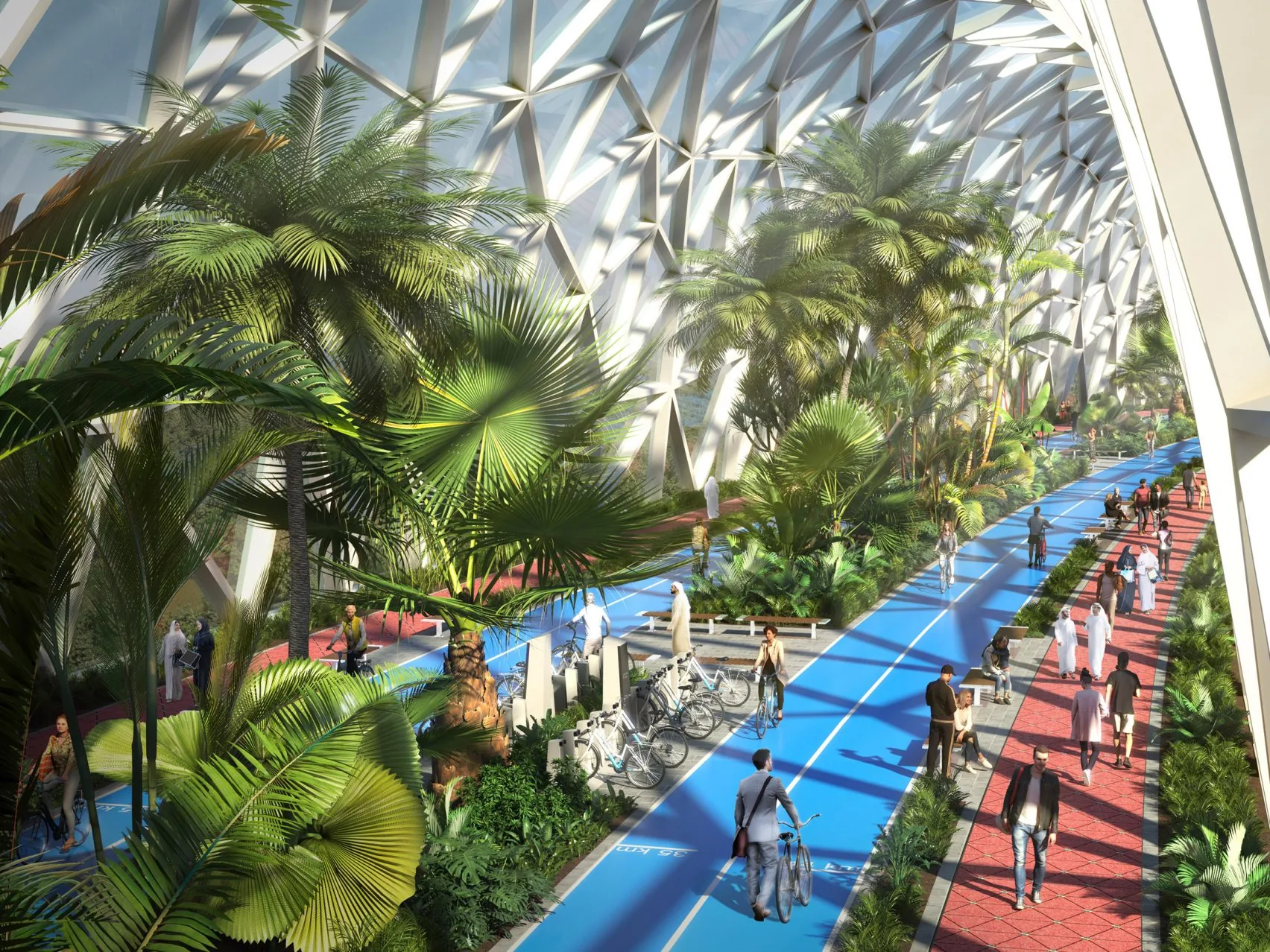 Inside The Loop in Dubai: a blue cycling lane and a red pedestrian corridor under a glass roof, lined with palm trees